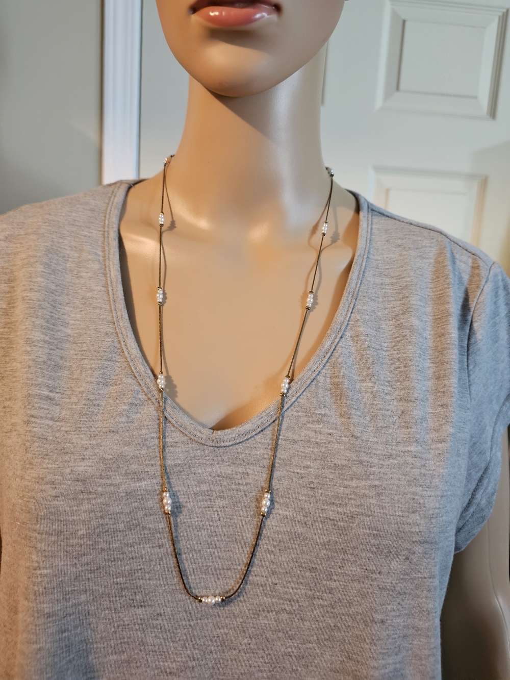 Long Delicate Gold Necklace with White Bead Accents